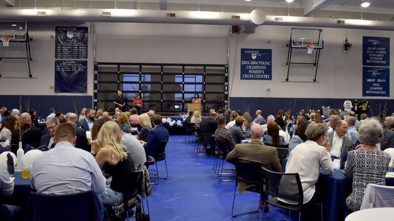 Kristen Vida welcomes everyone to the Lion Wine and Cheese event at the PAW Center on the campus of Penn State DuBois