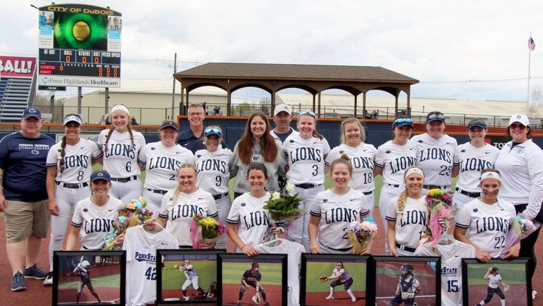 The softball team at Penn State DuBois gathering for a team photo during senior day festivities at Heindl Field