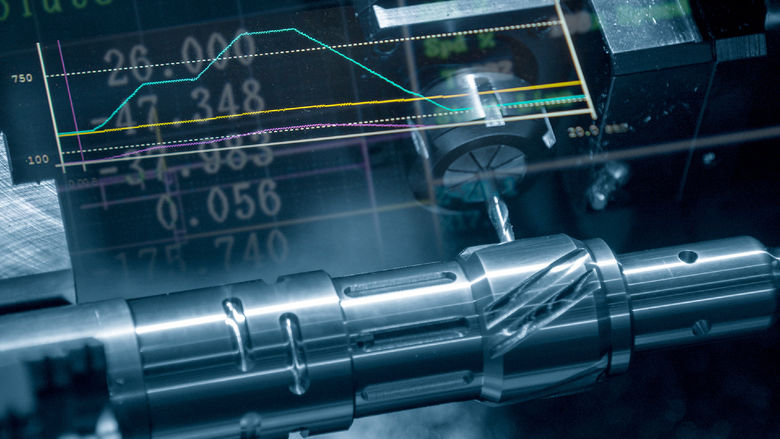 An abstract scene of a CNC lathe machine cutting a metal shaft with a mill turret.