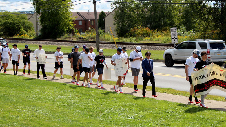 Participants from Penn State DuBois being their mile journey to “Walk a Mile in Her Shoes” to raise awareness of rape, sexual assault and gender violence.