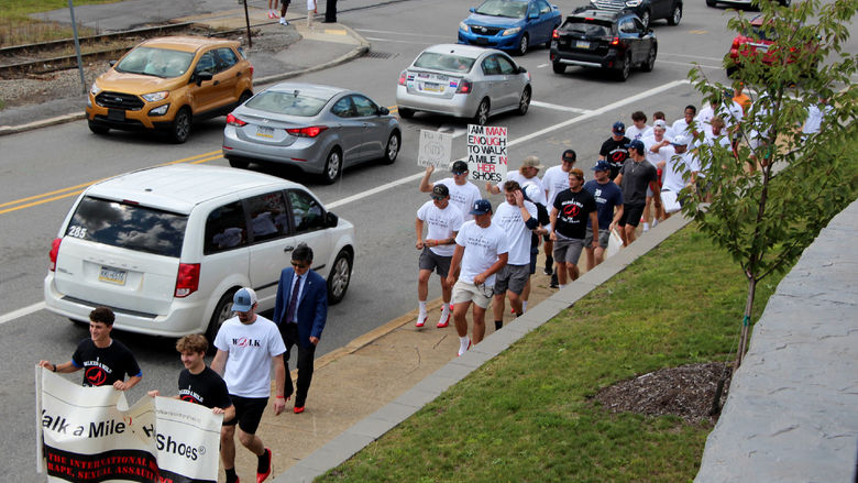 Walkers making the return route towards campus as they close in on the end of their mile journey during “Walk a Mile in Her Shoes”.