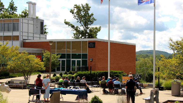 Students, faculty and staff members at Penn State DuBois observe a moment of silence during the memorial service held on campus on Sept. 11.
