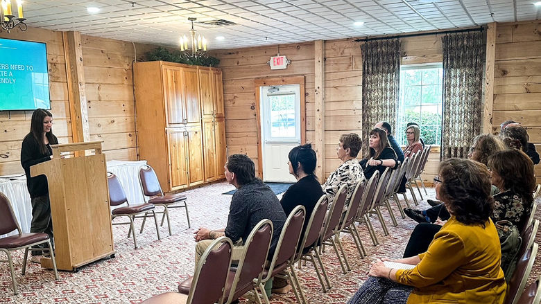 Jessica Clontz, at podium, giving her featured presentation at the recent Recovery Expo and Hiring Event.