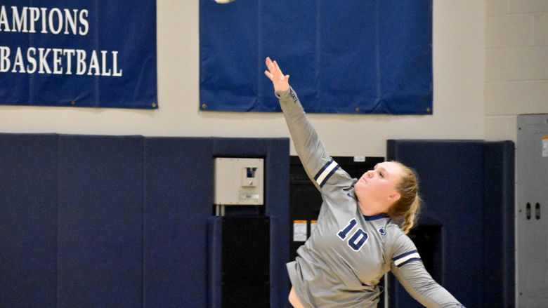 Penn State DuBois senior Paige Pleta follows through on her strike during the home match against Penn State New Kensington at the PAW Center.