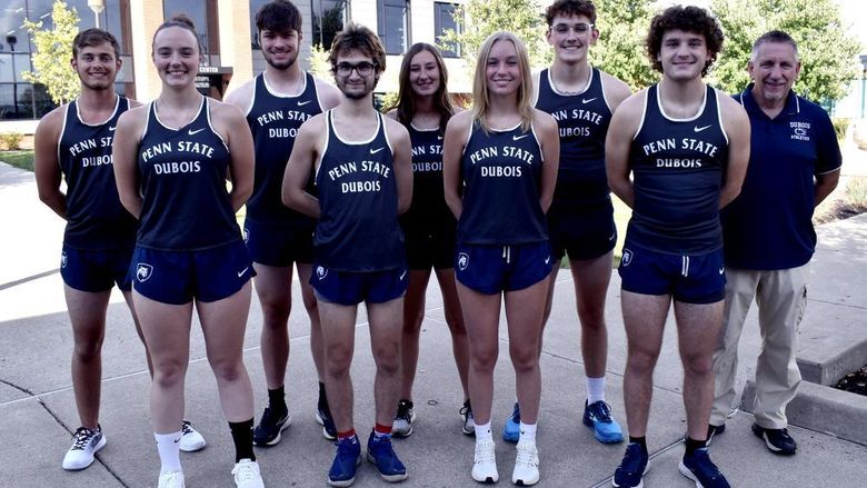 2023 Penn State DuBois Cross Country Team, men and women standing in front of the PAW Center building