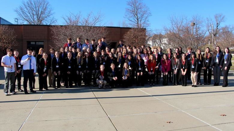 Medal winners from the 2023 Pennsylvania DECA District 1 conference gather at the Schoch Plaza, on the Penn State DuBois campus, following the awards ceremony.
