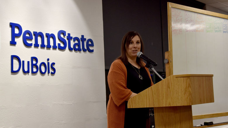Rebecca Pennington, director of student affairs, gives the opening address at the THON hair auction.