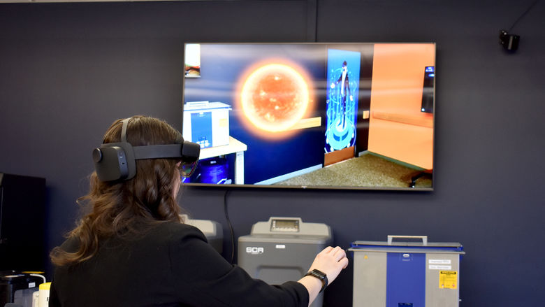 Anna Raffeinner, administrative support assistant and marketing for the NCPA LaunchBox, uses augmented reality equipment inside the Idea Lab on the campus of Penn State DuBois
