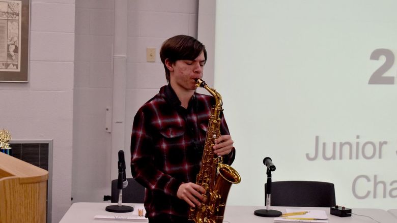 DuBois Area Middle School student Ian Jay plays the national anthem on his saxophone at the start of the junior scholastic challenge