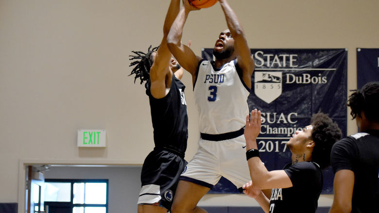 Penn State DuBois senior guard Jaiquil Johnson attempts a put back shot in the paint, with defenders all around him, during a recent game played at the PAW Center.