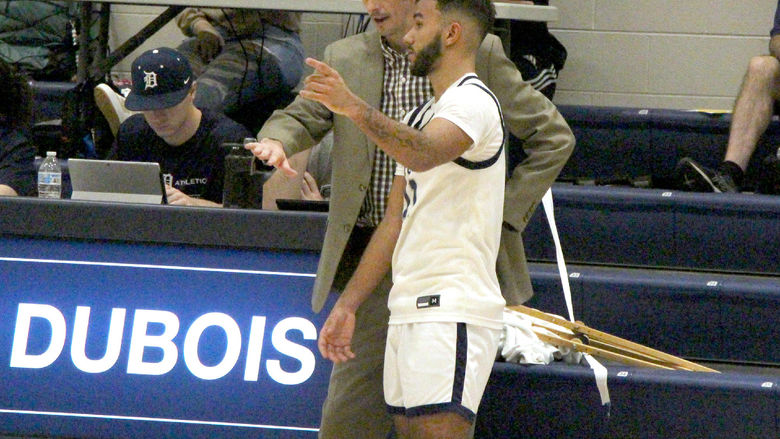 Penn State DuBois men’s basketball head coach Dan Smay discusses a defensive matchup with freshman Kaleb Pryor during a basketball game at the PAW Center this season. Smay was selected as the PSUAC men’s basketball coach of the year this season.