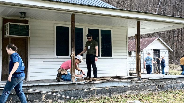 Students from the Christian Student Fellowship organization at Penn State DuBois work through a demolition project during their spring break service trip to Kentucky.