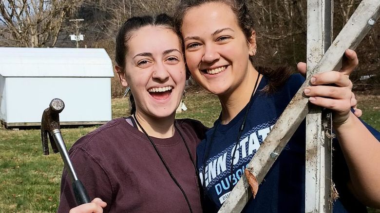 Penn State DuBois students Tayler Rafferty, left, and Hannah Thompson, right, pause for a moment for a picture during their service trip to Kentucky as part of a group from Christian Student Fellowship at Penn State DuBois.