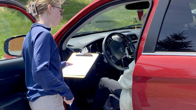 Penn State DuBois OTA student Fiona Riss assists an attendee with a CarFit session at the health and wellness fair at Christ the King Manor on April 25.