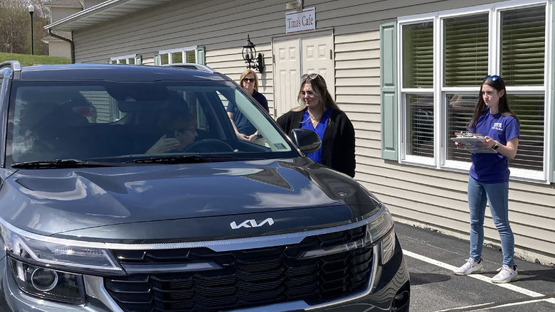 Penn State DuBois OTA students Emily Busija, center, and Maddie Barsh, right, work through a CarFit session as Amy Fatula, assistant teaching professor, watches on at the health and wellness fair at Christ the King Manor on April 25.