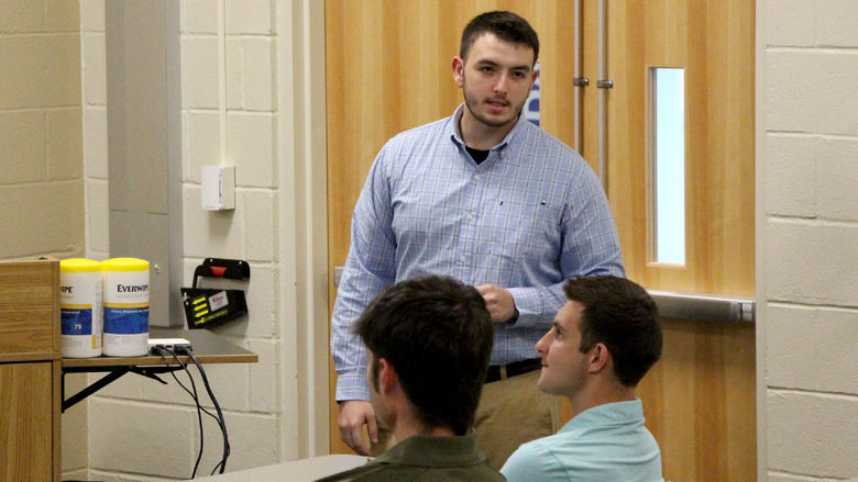 Penn State DuBois student Ethan Kness answers a question at the conclusion of his internship experience presentation.