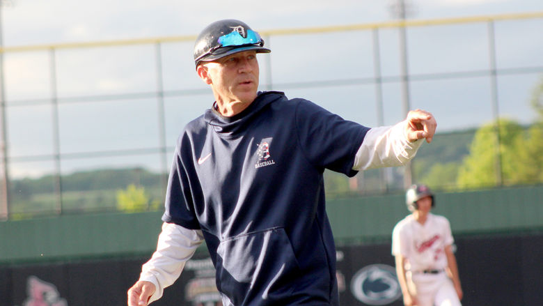 Former Penn State DuBois baseball head coach Tom Calliari gives instructions to his catcher on his way back to the dugout from a mount visit during the 2024 USCAA Small College World Series.