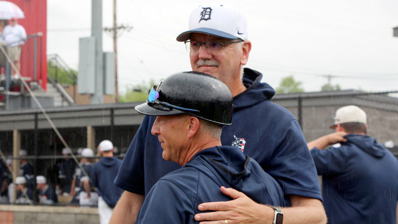 Former Penn State DuBois baseball head coach Tom Calliari, front, embraces long time assistant coach Mike Nesbit following a game during the 2024 USCAA Small College World Series.