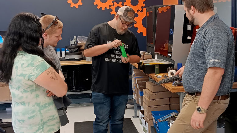 Student in the post high school CNC training program work with Johnny Williams, engineering technologist, in the Idea Lab, part of the North Central PA LaunchBox powered by Penn State DuBois.