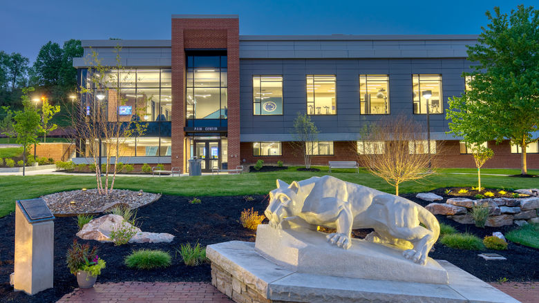 The Lion Shrine, in the foreground, on the Penn State DuBois campus outside the entrance of the PAW Center, which is visible in the background.