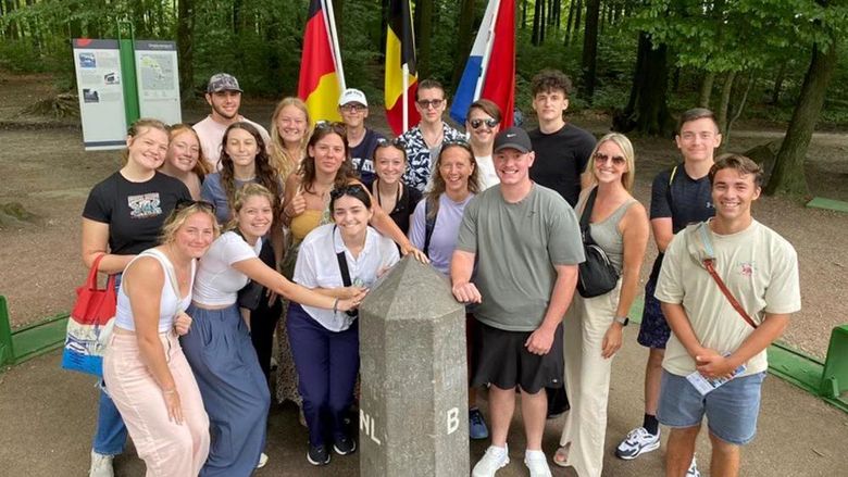 Students and trip advisors from Penn State DuBois gather for a group picture at The Three County Point, where Germany, Belgium, and the Netherlands meet.