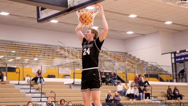 Penn State DuBois senior forward Beau Verdill slams the ball home during a drive in the lane in the second half of the team’s game at Clarion University on Nov. 26.