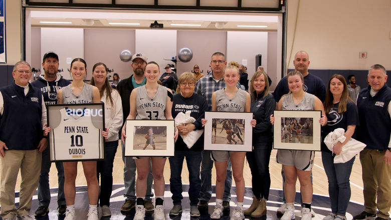 A group photo from the 2025 Penn State DuBois women’s basketball team senior day festivities. Members of the team that were honored are joined by family members and members of the coaching staff.