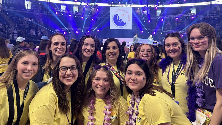 Representatives from Penn State DuBois, including this year’s THON dancers from the campus, gather on the dance floor at the Bryce Jordan Center during THON 2025.