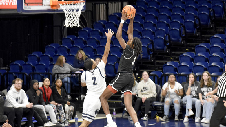 Penn State DuBois junior guard Niare Poplar goes up to slam the ball for a score during the PSUAC championship game at the Bryce Jordan Center.