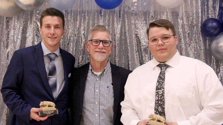 Penn State DuBois students Garret Park, left, and Elliot Park, right, stand for a photo with Scott Muirhead, lecturer of business administration, during the annual Recognition and Awards Banquet at Penn State DuBois.