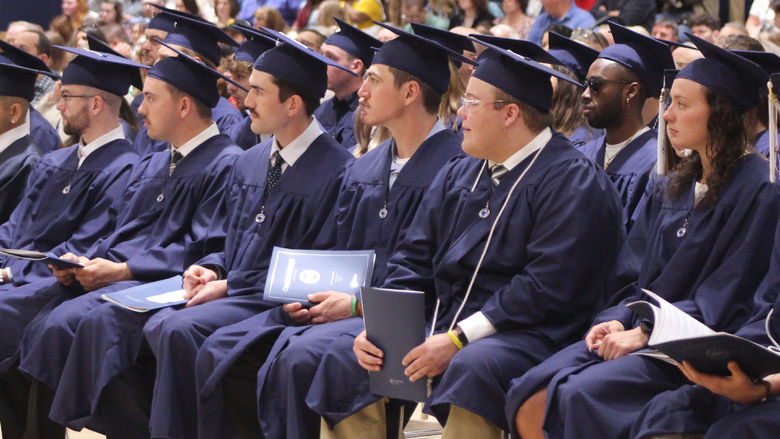 Soon to be Penn State graduates listen to commencement speaker, Daniel Kohlhepp, during the spring commencement ceremony at Penn State DuBois.