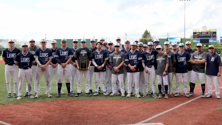 The Penn State DuBois baseball team stands for a group picture with the third-place plaque during the USCAA Small College World Series at Showers Field in DuBois.