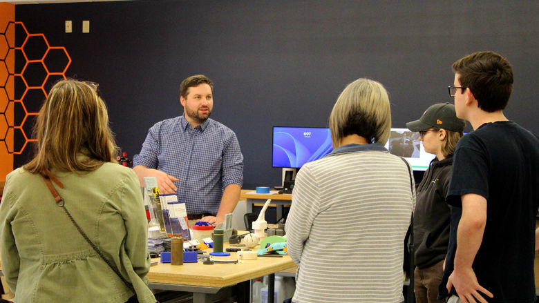 Johnny Williams, engineering technologist at Penn State DuBois and the NCPA LaunchBox, gives a group of attendees at the Industry 4.0 Academy open house a tour of the Idea Lab, one of the many sites used in the academy at Penn State DuBois.