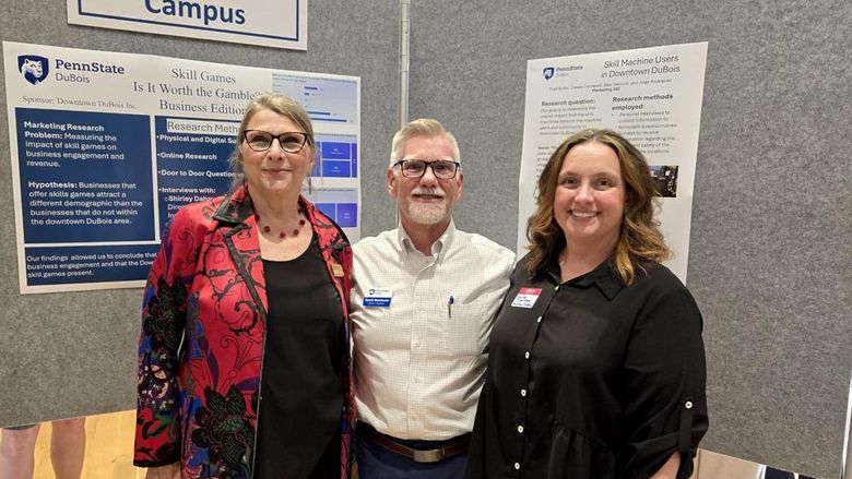 Scott Muirhead (center), lecturer in business administration at Penn State DuBois, stands with Ilona Ballreich (left), program pirector, Sustainable Communities Collaborative, Penn State Sustainability, and Shirley Dahrouge (right), executive director of Downtown DuBois Inc., during the 2025 Campus and Community Sustainability Expo, held April 30 at the Palmer Museum of Art.