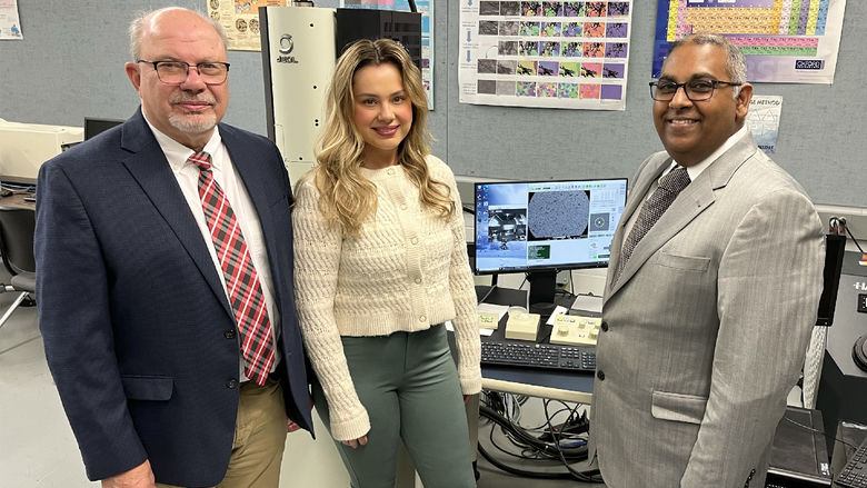 Ramakrishnan Rajagopalan, professor of engineering at Penn State DuBois, right, stands next to Tony Zaffuto, president of Metaltech, left, and Bethany Zaffuto, marketing lead for Metaltech, center, in one of the engineering labs at Penn State DuBois.