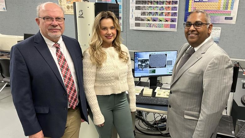 Ramakrishnan Rajagopalan, professor of engineering at Penn State DuBois, right, stands next to Tony Zaffuto, president of Metaltech, left, and Bethany Zaffuto, marketing lead for Metaltech, center, in one of the engineering labs at Penn State DuBois.