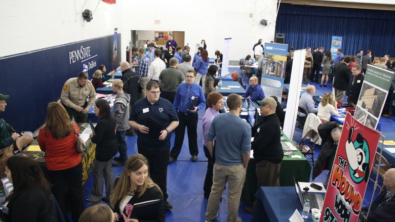 Job seekers learn about career opportunities from local industry representatives. 