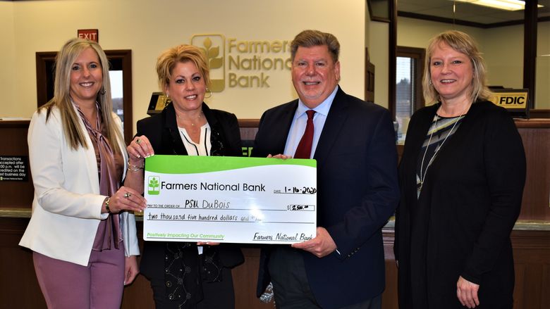 Left to right, Farmers National Bank Vice President of Business Banking Danyell Bundy and DuBois Branch Manager Kelli Allison present a $2,500 check to Penn State DuBois Chancellor M. Scott McBride and Director of Development Jean Wolf. 