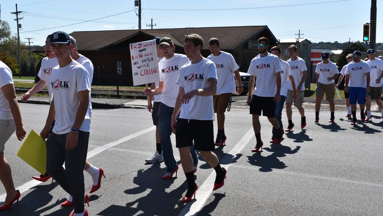 Men walking in high heals.