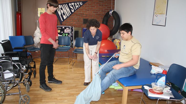 Students perform occupational therapy excercises. 