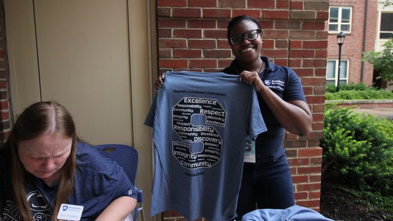 Penn State staff checks-in delegates for the Summer Leadership Conference