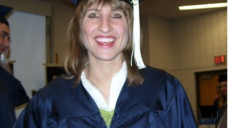 April M. Meyer in her cap and gown after graduation.