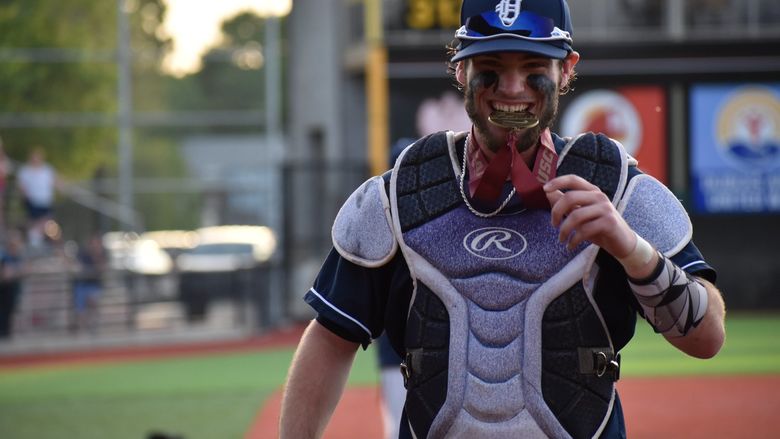 Baseball catcher with medal
