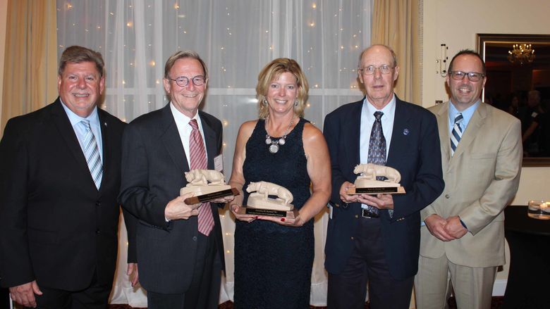 left to right M Scott McBride Chancellor Bob Johnson Distinguished Alumni Christine Beretsel Outstanding Alumni Ross Kester Lifetime Achievement