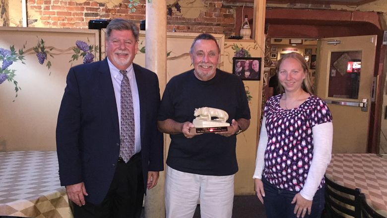 William G Allenbaugh '73, Outstanding Alumni Award recipient (center) was presented with his award by Chancellor M. Scott McBride (left) and Alumni Society President Kris Cryster (right).