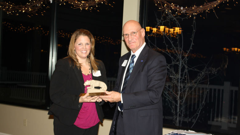 Christina Swank Voorhees '02 accepting the 2011 Outstanding Alumni from Joseph Hummer '70