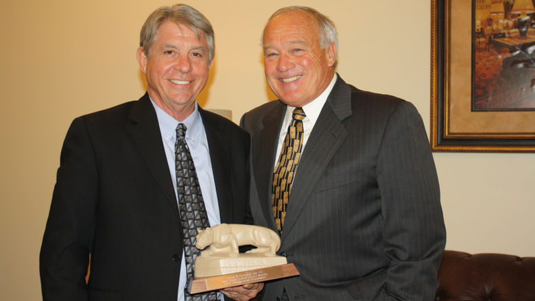 Dan Kohlhepp '69 receiving the Distinguished Ambassador Award from Ryan McCombie '70