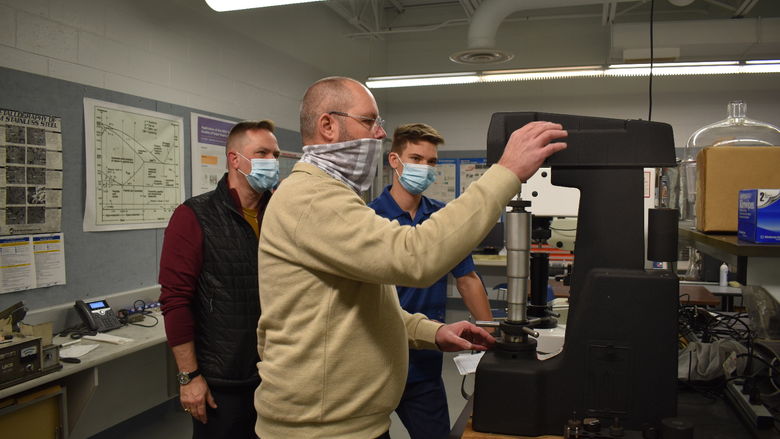 Scot Coble conducts a harness test in the campus engineering lab. 
