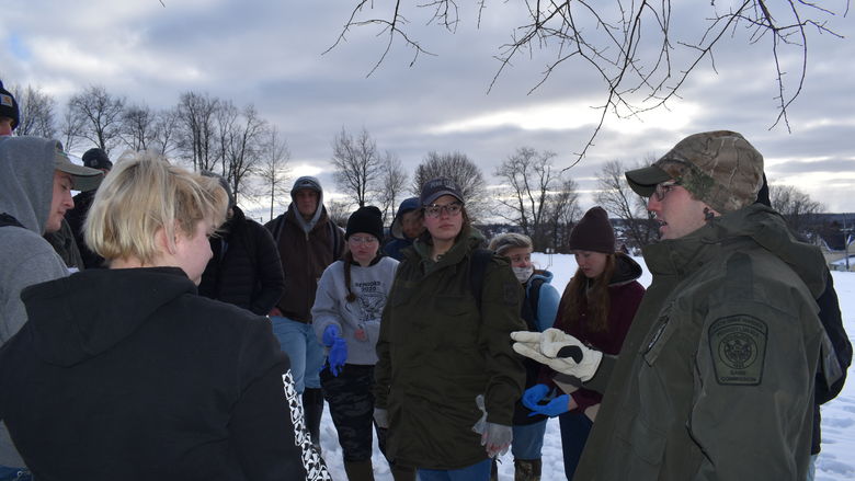 Pennsylvania State Game Warden Thomas Henry led students in a simulated investigation of the illegal killing of a deer.  
