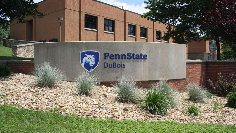 Sign at the front of Pennn State DuBois - Smeal Building in the background. 